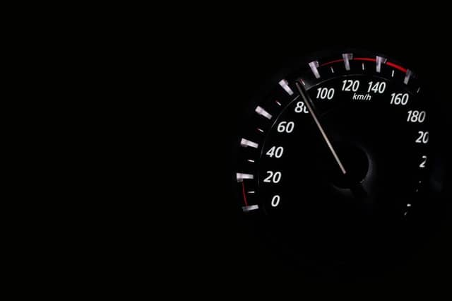 A speedometer approaching 100 km/h